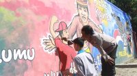 Lewat Mural, Polsek Plemahan Ajak Pelajar Kampanyekan Pilkada Aman dan Kondusif